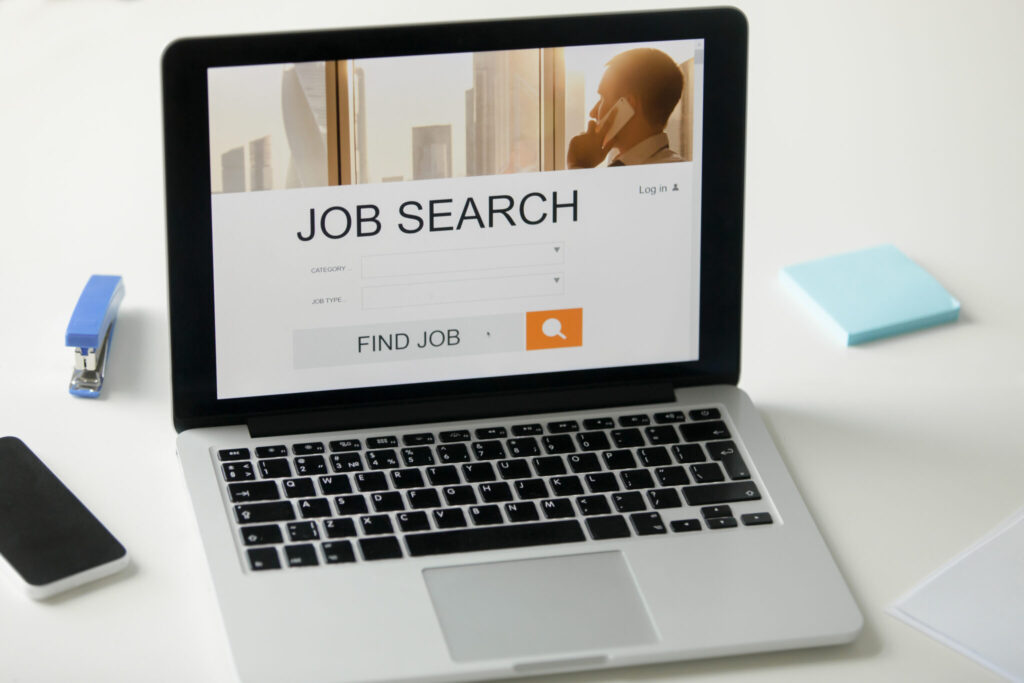 open laptop desk job search title screen 2048x1365 1